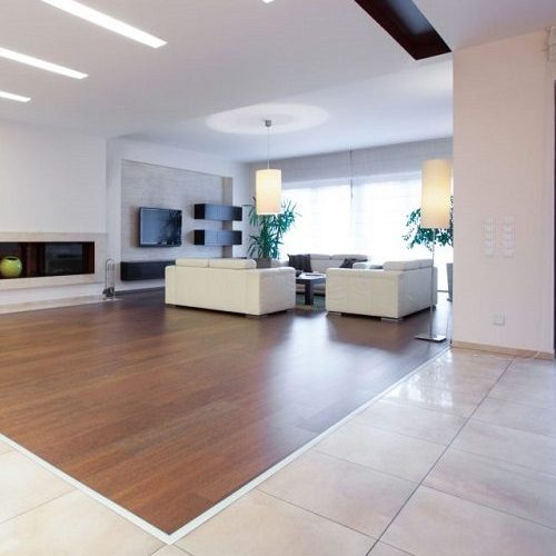 A Picture of an Enormous House with a Spacious Bright Living Room.