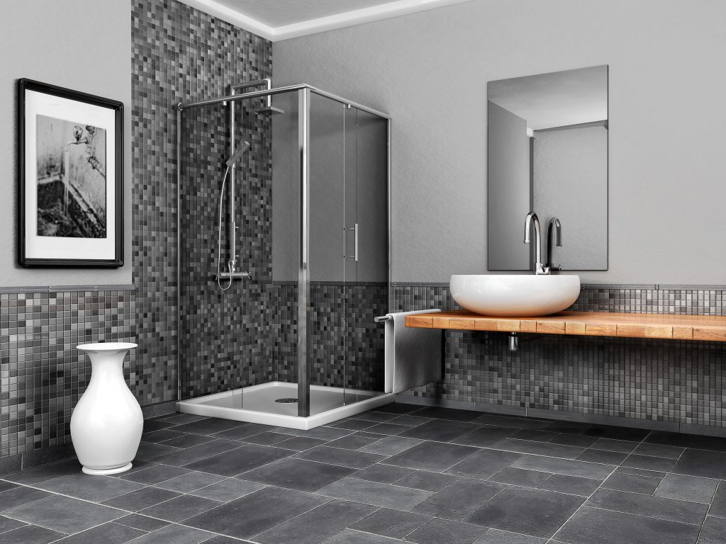 A Picture of a Large Bathroom with a Stone and Mosaic Grey Tone Tile.